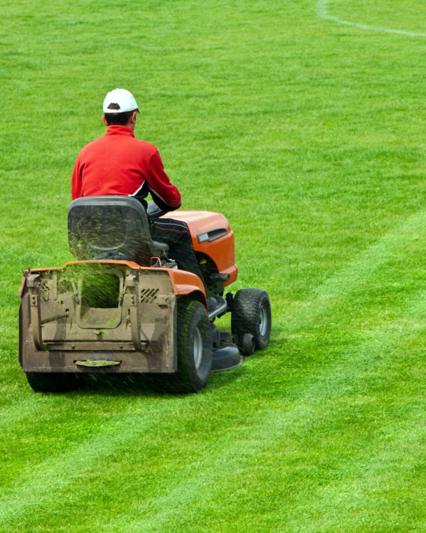 Mowing grass in stadium